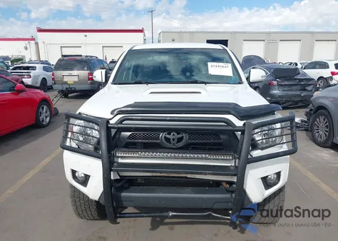 2015 Toyota Tacoma Base V6 z USA, uszkodzony, nr VIN 3TMMU4FN0FM083581